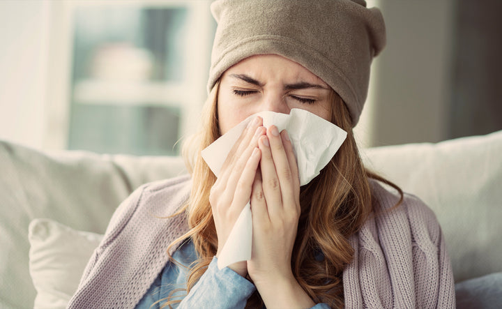 5 Ways to Boost Your Immunity: Woman Sneezing